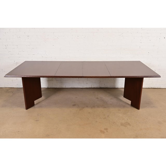 A rare and exceptional mahogany "Taliesin" double pedestal extension dining table By Frank Lloyd Wright for Heritage...