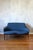 The Finn Juhl NV 53 is a two-seater sofa made of teak and has been reupholstered in epping textile. Designed in 1953, this...