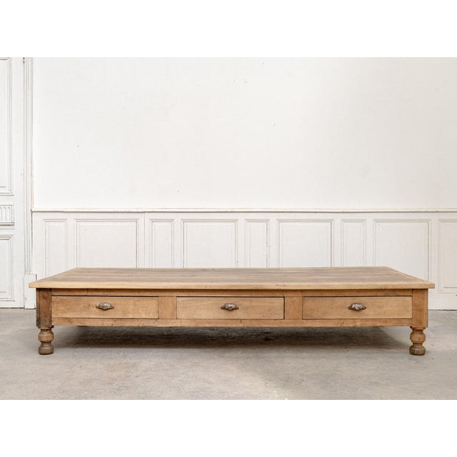 An exceptional draper's coffee table dating from the late 19th century, recognizable by its particularly thick top and six...