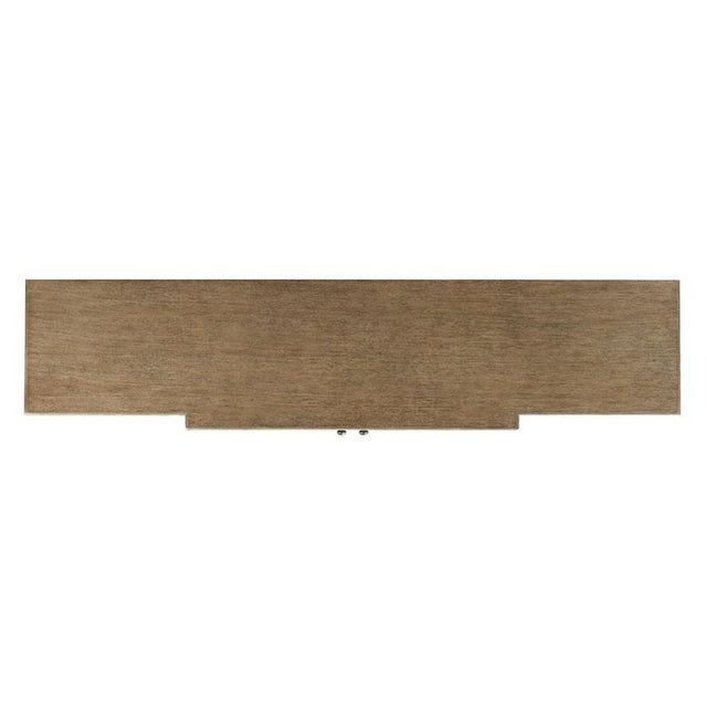 A handsome cabinet with a rectangular top resting over square posts that flank four framed oak veneered doors raised by...