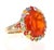 6.29 Carat Fire Opal Sapphire Diamond Yellow Gold Cocktail Ring This ring features a 4.40 carat Oval Cut Fire Opal at its...