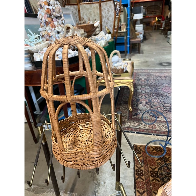 Up for consideration is a beautiful vintage wicker bird cage. This would look lovely in your home and it is a great way to...