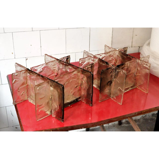 This pair of Murano glass and steel sconces was designed by Carlo Nason for Mazzega in the 70's. I have official proof of...