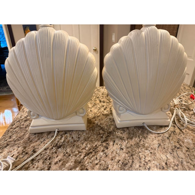Beautiful vintage pair of shell-shaped table lamps with a classic coastal / Hollywood Regency feel. The substantial...