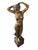 Elegant vintage figural sculpture depicting a graceful young woman standing in a flowing gown, her arms raised as she...