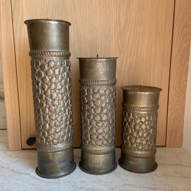 Incredible set of antique handmade trench art candle holders from brass shell casings. Beautiful repousse crocodile...