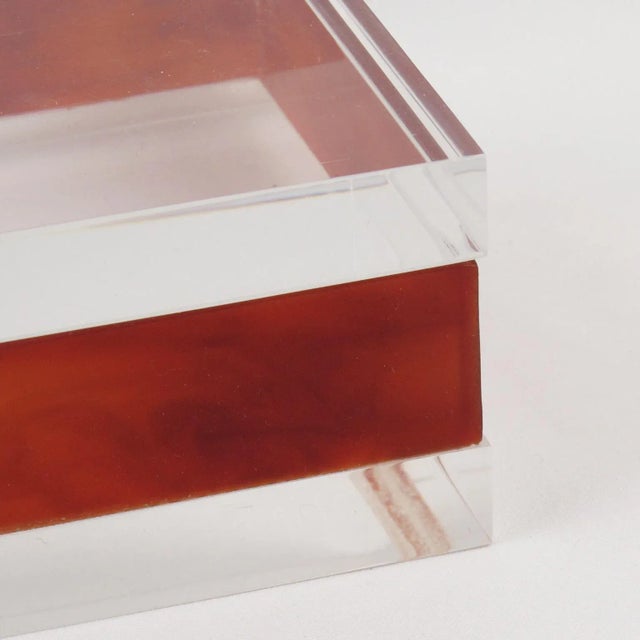 This stunning modernist Lucite, acrylic lidded box was crafted in France in the 1970s. The piece boasts transparent and...