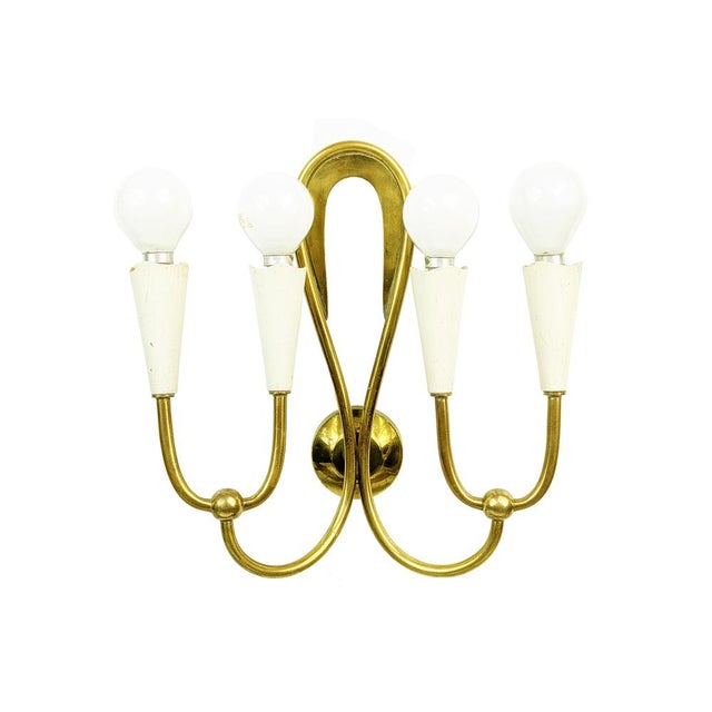 Set of 4 wall lamps made in Italy in the 1950s. Each lamp is equipped with 4 ivory metal lamp holders (E14 small socket...