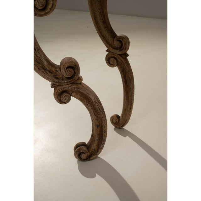 This 19th century French Baroque Revival console table showcases exceptional craftsmanship and richly sculpted detail,...