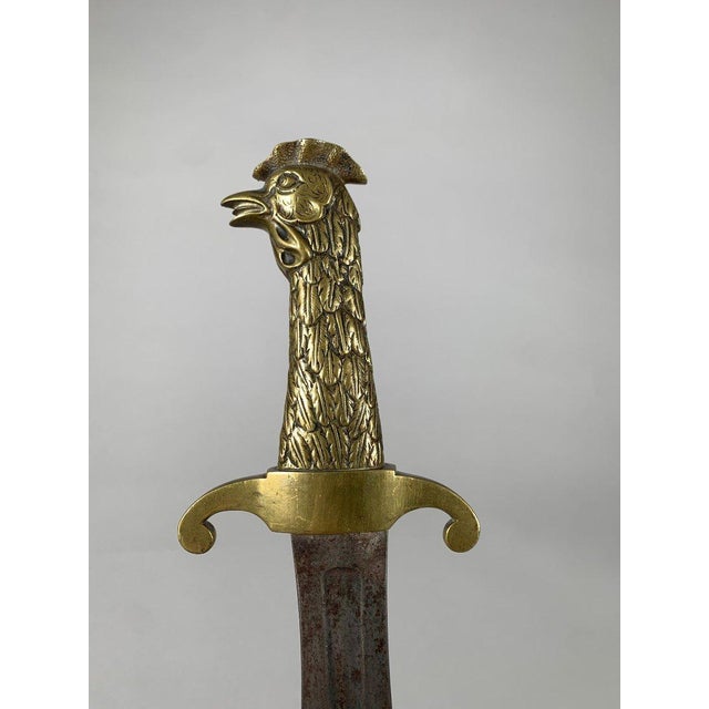 A royal constitutional guard sword with a rooster motif, dating from the late 18th century of the French Revolution. The...