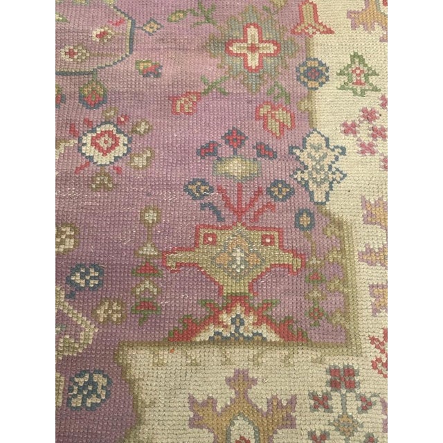 Nice antique Turkish Ghyordes rug with beautiful oushak style and design with a pink field on the center white field at...