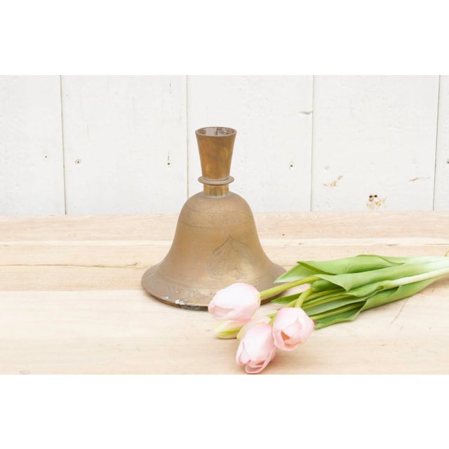 A lovely metal bell shaped flower base made from copper. This beautiful antique Indian candlestick holder is decorated...