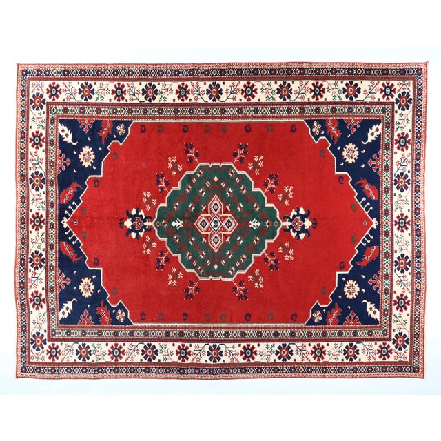 This authentic vintage hand-knotted Oushak rug is crafted from 100% pure wool and dyed using natural vegetable dyes,...
