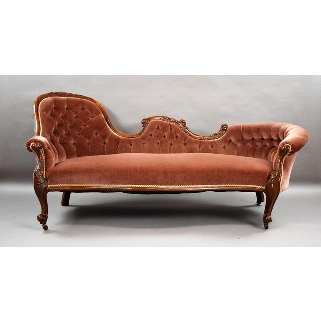Victorian Carved Walnut Chaise Lounge An elegant Victorian walnut chaise longue, dating from circa 1860. The sweeping...