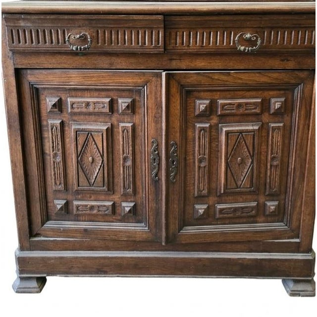 This French Provincial Buffet à Deux Corps (literally meaning "buffet with two bodies") is a classic example of...