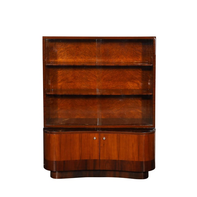 This stunning Art Deco bar cabinet encapsulates the glamour and sophistication of the 1940s with its bold geometric design...