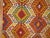 Colorful vintage Turkish Kilim flat-weave from the mid-20th century. Cherry red, chartreuse, and orange dominant accents...