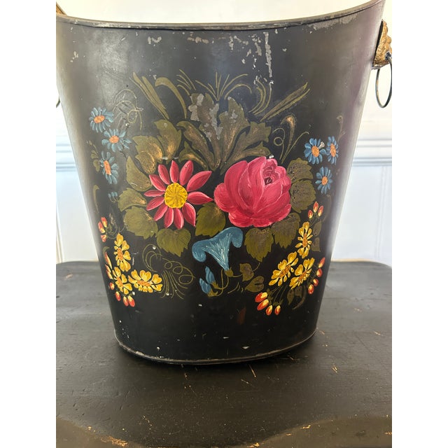 European in inspiration, this piece showcases traditional toleware techniques, with visible brushwork and layered...