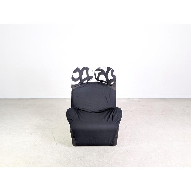 Beautiful Cassina Wink Chair in black fabric with white and black wingback cushions for sale. This chair is considered a...