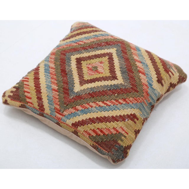 A one-of-a-kind handwoven Afghan wool kilim accent pillow featuring fine concentric diamond. Cut and sewn by hand from a...