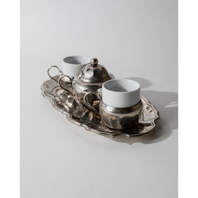 This vintage silver-plated coffee set from the 1960s is a charming example of elegant mid-century tableware. The set...