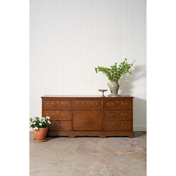 Exquisite Late Georgian Period Oak + Mahogany Banded Dresser Base (c. 1780). This piece offers ample storage with several...