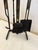 Elegant set of mid-century modern iron and brass fireplace tools.