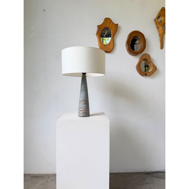 Vintage small ceramic table or desk lamp from the 1960s/70s, inspired by Vallauris pottery. We love the delicate shape of...