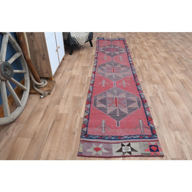 Vintage Turkish Hand-Knotted vintage rug is a semi-antique vintage runner rug. The '70s Eastern region of Turkey's unique...