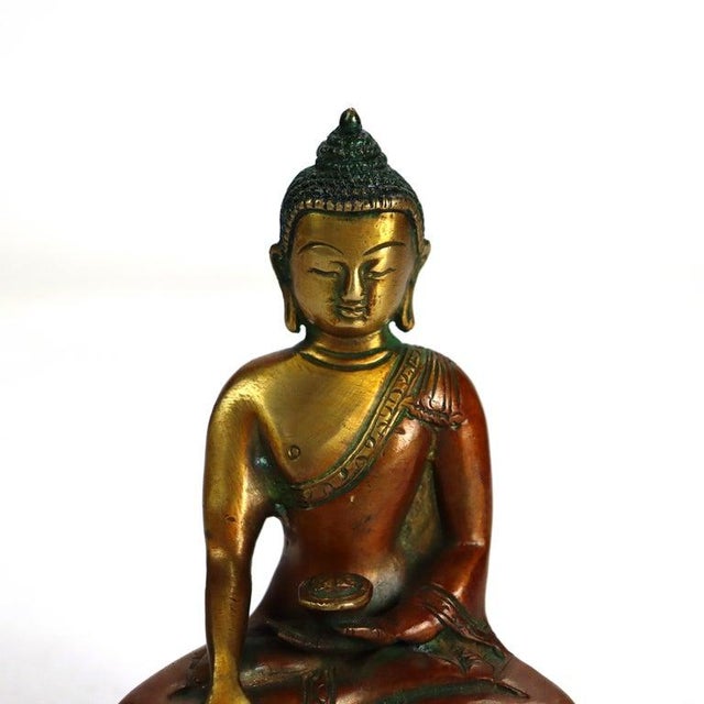 Antique Bronze Buddha Figure C1920 Measures - 5 1/2" x 3 7/8" x 2 3/4" An antique bronze Buddha figure from circa 1920....