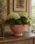A handsome Italian terracotta planter by Antonini, shaped as a broad, shallow bowl raised on a gently molded circular...