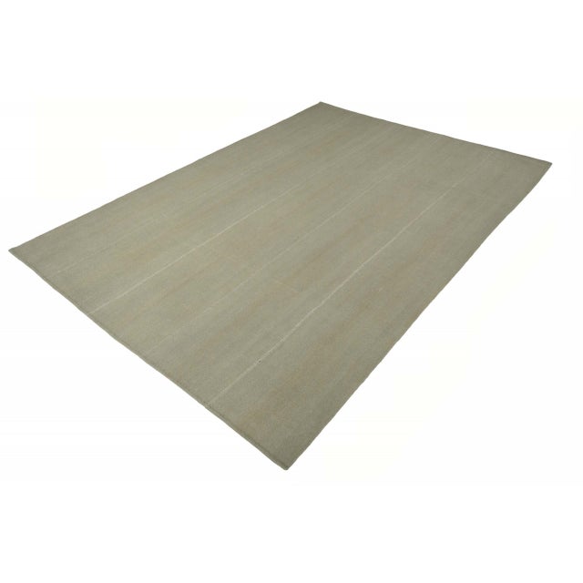 This rare and elegant kilim from the Mazandaran region combines traditional weaving craftsmanship with modern minimalism....