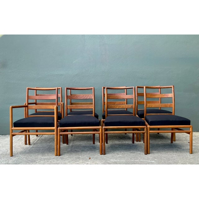 Designed by T. H. Robsjohn Gibbings for Widdicomb, this set of eight dining chairs presents a refined mid-century modern...