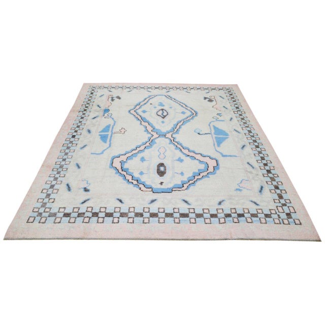 Modern Moroccan Beni Ourain hand knotted wool rug with soft texture.