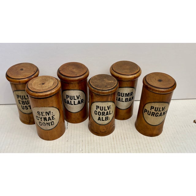 Set of 6 antique turned wooden apothecary containers traditionally used by apothecaries to store historical remedies and...
