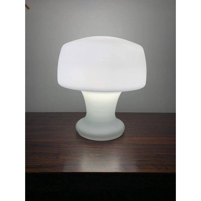 Mid century modern Laurel Mushroom table lamp. Blown opaque white glass forms a unique sculptural mushroom shape. Made...
