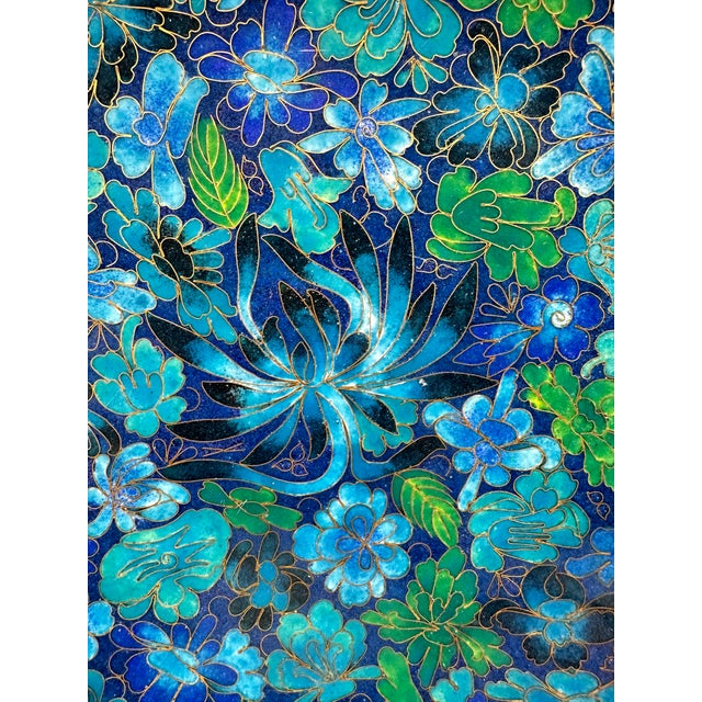 Vintage Chinese cloisonné plate decorated with flowers and leaves on a solid brass stand. This is a pre-owned item so...