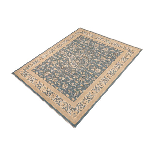 Enhance the ambiance of your home with this magnificent Persian-influenced Turkish hand-knotted rug made by skilled...