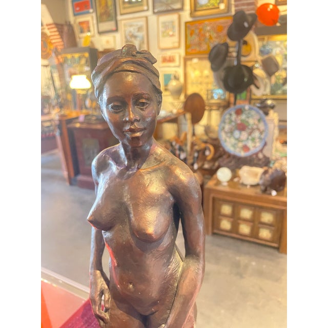 A beautiful Bronze of a nude woman. Signed by bronze artist Marlene Amerian and numbered 2/20. Marlene Amerian works in...