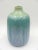 Subtle colors yet striking, this very pretty pastel vase would pair well in many different genres Many areas at the base...