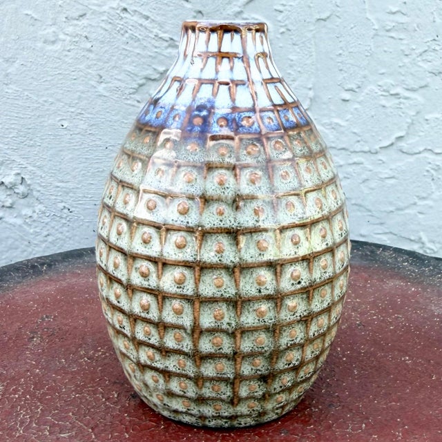 This vintage mid century glazed ceramic stoneware vase showcases the artistry of classic studio-style pottery. Its ovoid...