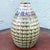 This vintage mid century glazed ceramic stoneware vase showcases the artistry of classic studio-style pottery. Its ovoid...