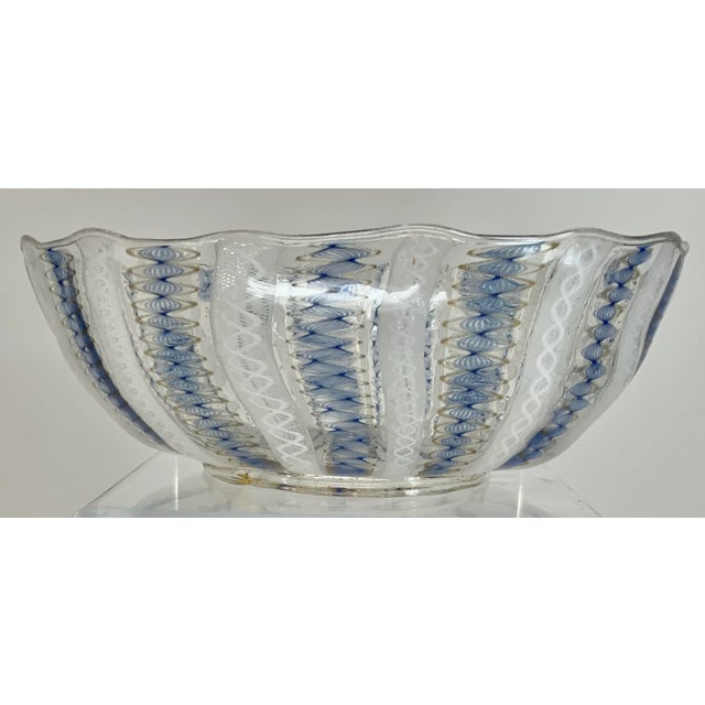 Beautiful vintage Venetian glass bowl with delicate latticino twisted ribbons design in blue , gold and white on clear...