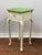 Sweet American Queen Anne style end table. Old distressed green painted top with a white base. The piece is constructed...