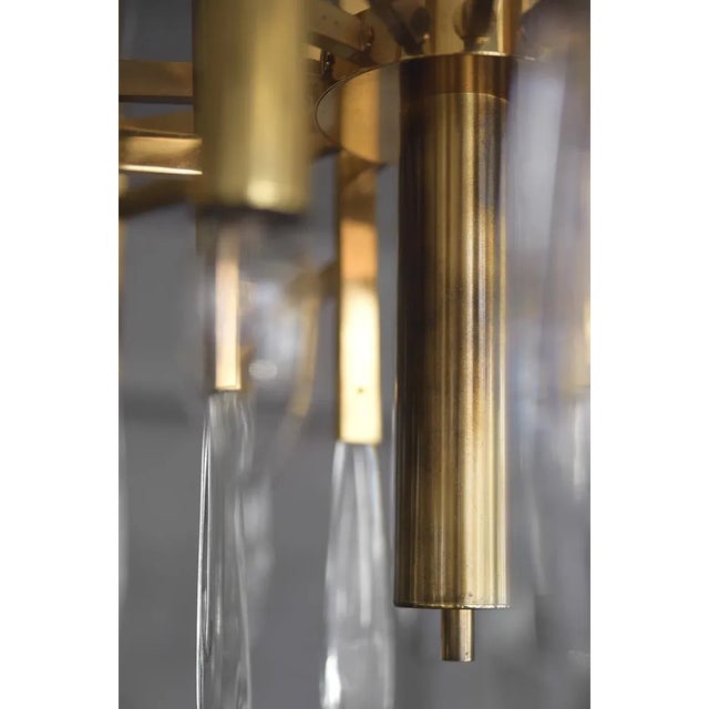 This stunning chandelier by Gaetano Sciolari was manufactured in Italy during the 1970s. It is made from highly polished...