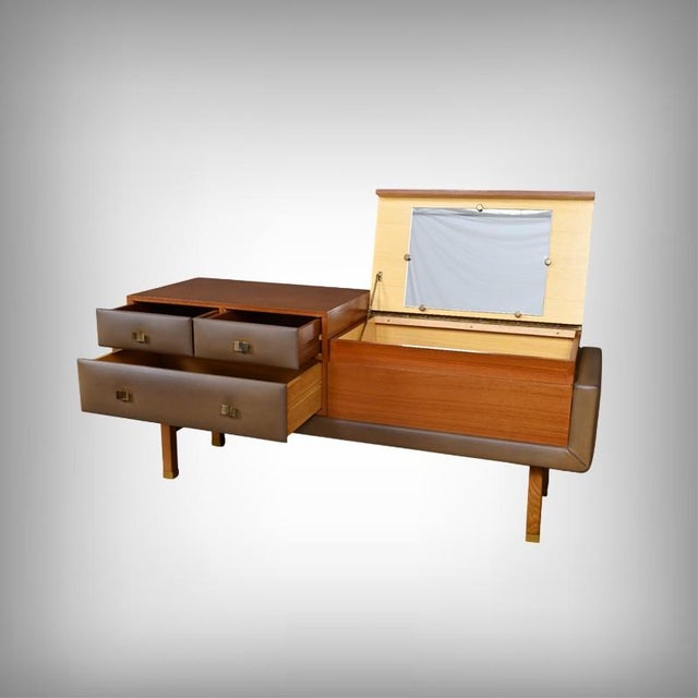 This elegant teak dressing table, designed by the French designer Roger Landault (1919–1983)*, embodies the refinement of...
