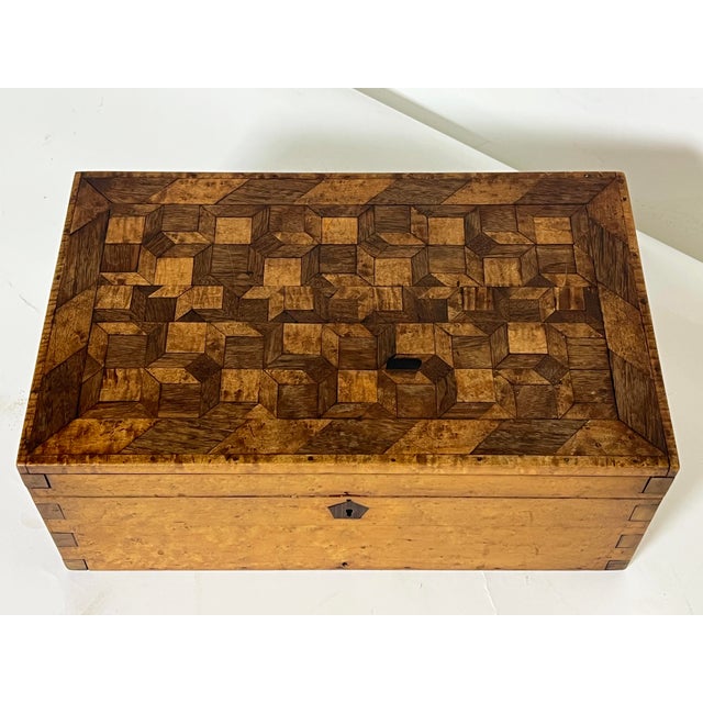 An antique 18th century New England dovetailed and boxwork inlaid document chest in butternet and walnut.