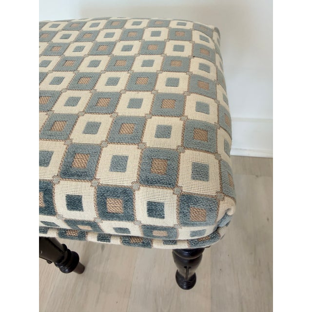 Charming English vintage stool featuring elegant turned dark wood legs and a beautifully patterned upholstered seat. The...