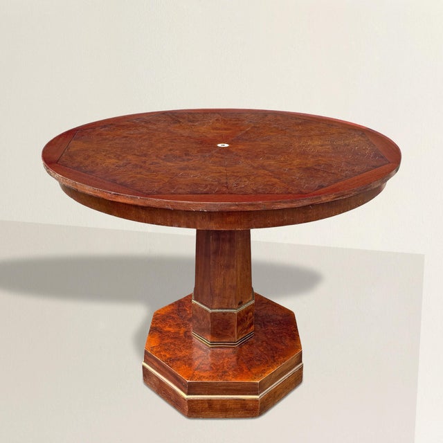 French Art Deco always understood the seduction of surface, and this burled walnut center table leans into it...