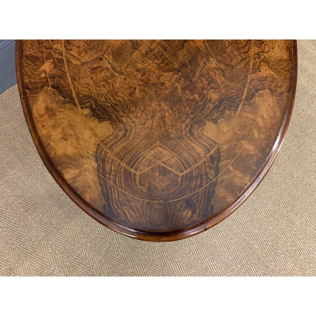 An excellent mid Victorian period burr walnut stretcher table. Very well made in solid walnut with attractive burr walnut...